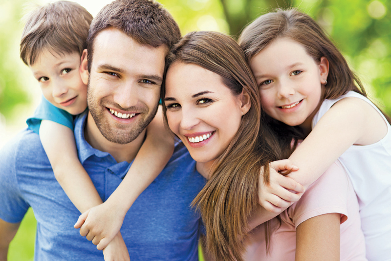 Blonde woman holding a green apple
